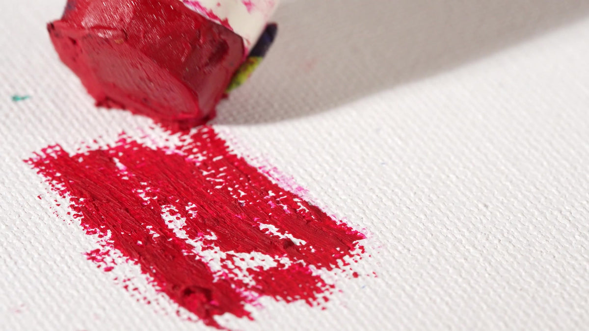 Red PHOENIX water-soluble oil paint stick marks before blending with a wet brush; frame from a real demonstration.