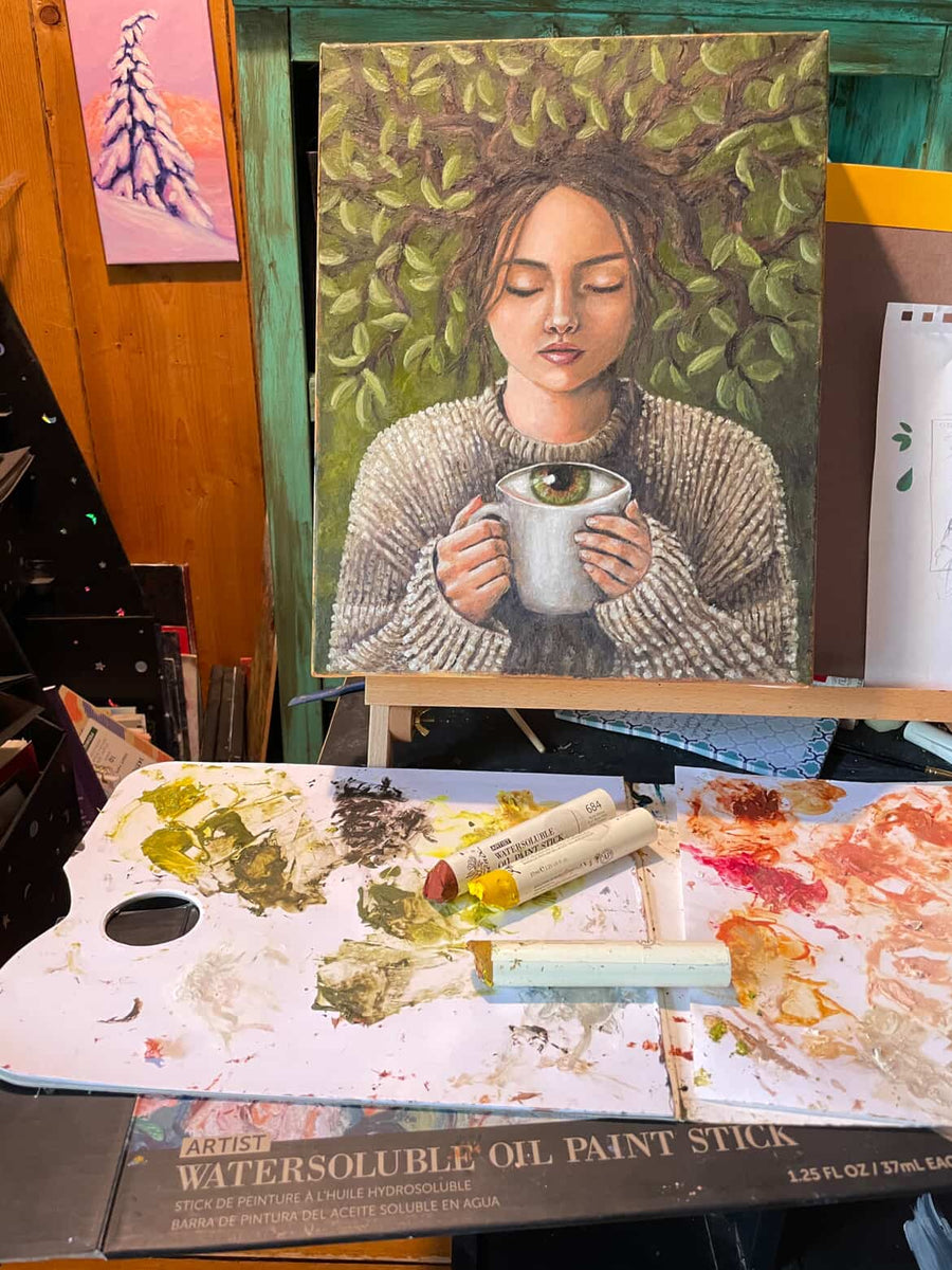 Portrait study with a cup and leafy background — @treetalker